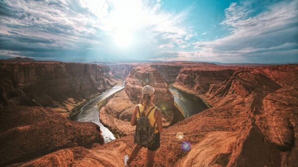 woman standing on top of canyon